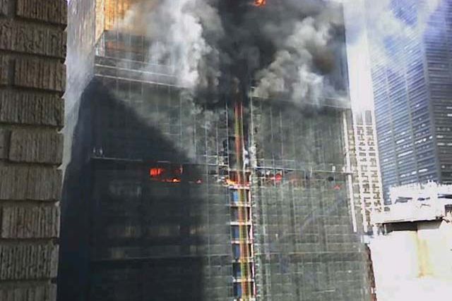 Photograph of the Deutsche Bank building on fire by Todd Myers